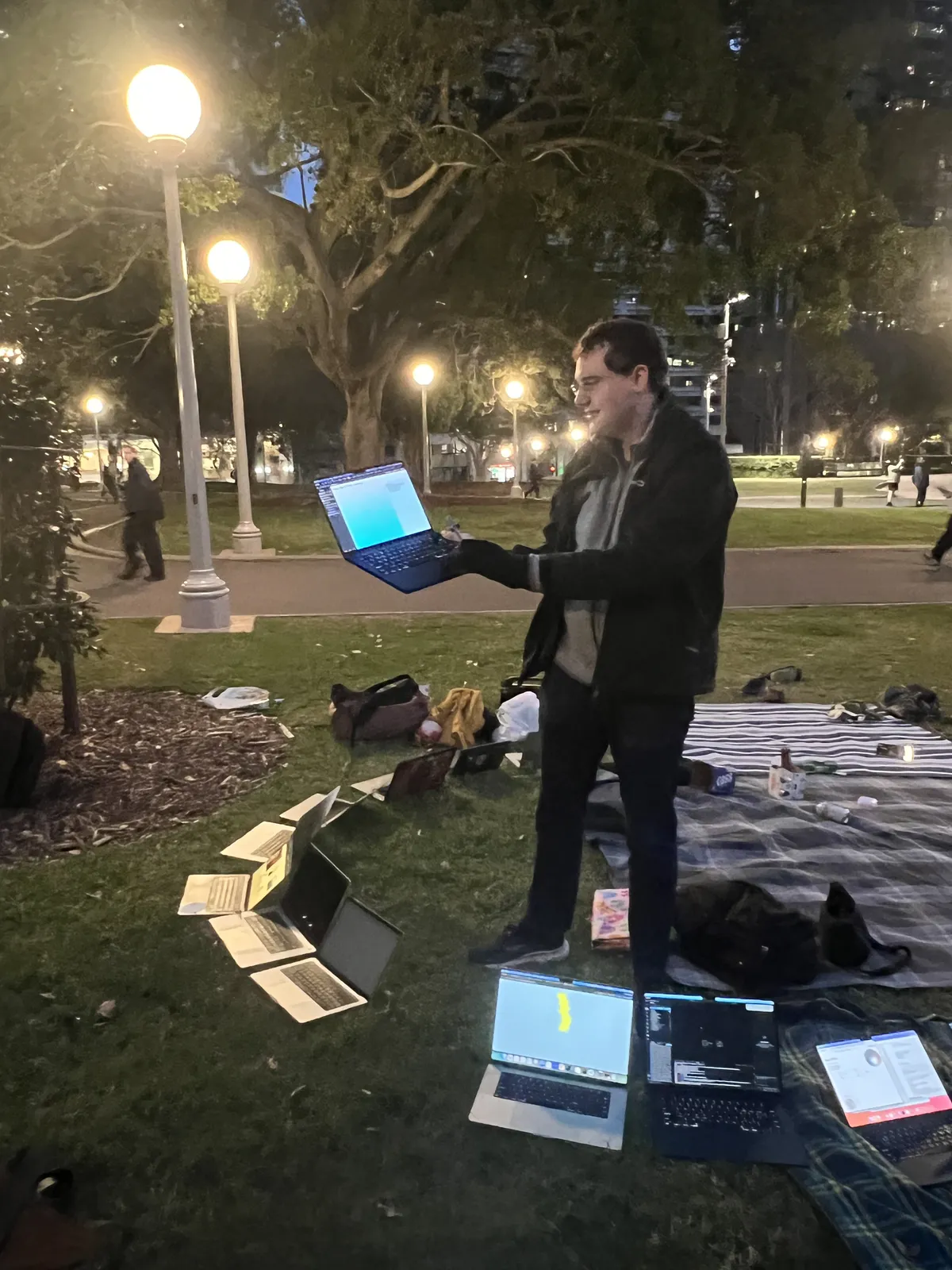 Working on a laptop under the park lights